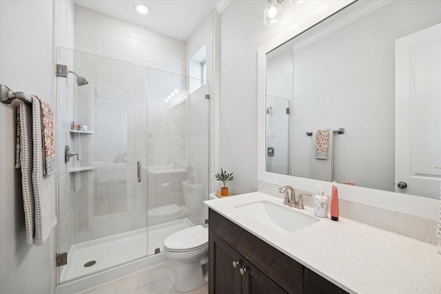 full bath with toilet, a shower stall, tile patterned floors, and vanity