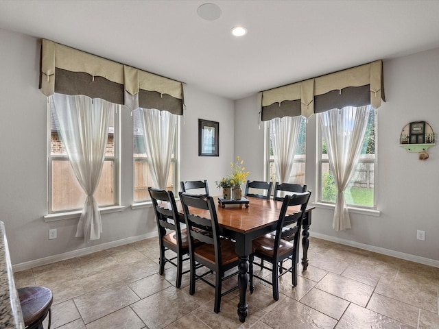 dining space with baseboards and recessed lighting