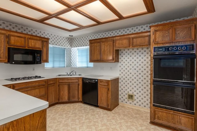 16918 Ascot Meadow Dr, Sugar Land, TX 77479 - kitchen with brown cabinets, wallpapered walls, a sink, and black appliances