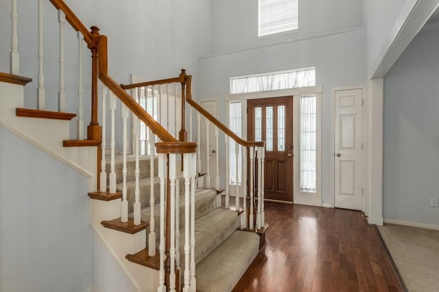 16918 Ascot Meadow Dr, Sugar Land, TX 77479 - entrance foyer featuring stairway, a high ceiling, baseboards, and wood finished floors