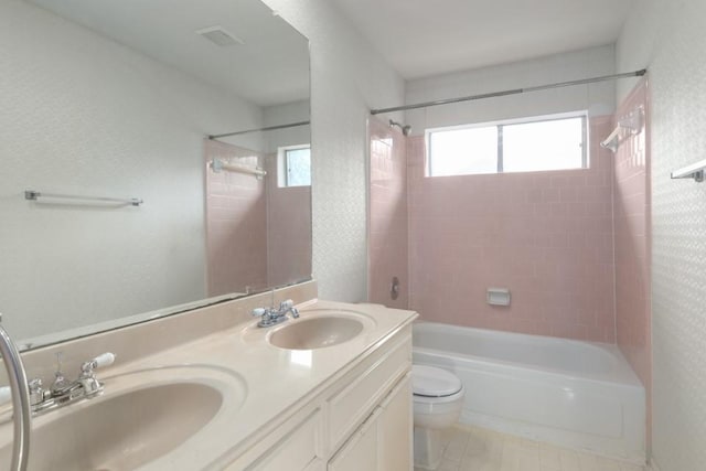 16918 Ascot Meadow Dr, Sugar Land, TX 77479 - full bathroom featuring a sink, toilet, double vanity, and shower / bathing tub combination