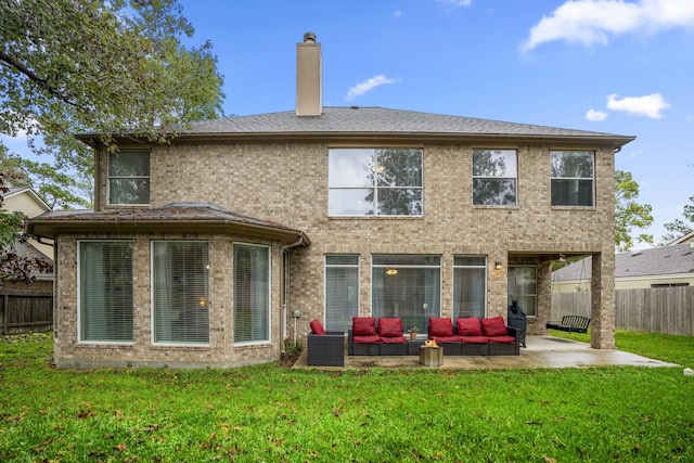 11826 Thoreau Dr, Montgomery, TX 77356 - rear view of house with a lawn, fence, outdoor lounge area, and a patio area