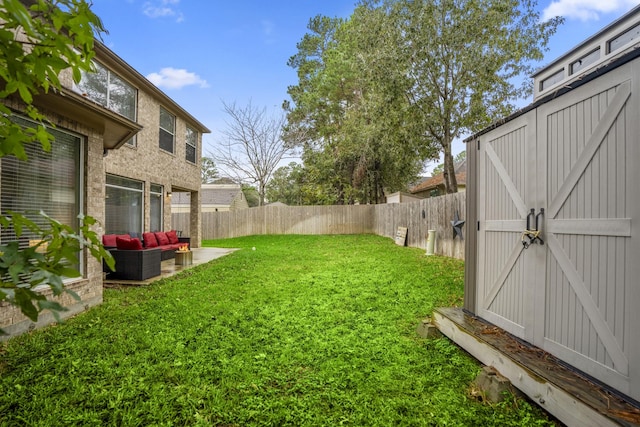 11826 Thoreau Dr, Montgomery, TX 77356 - view of yard featuring an outdoor living space, a fenced backyard, an outbuilding, and a storage unit