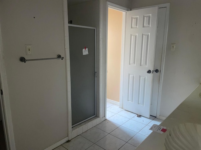 hallway featuring light tile patterned flooring