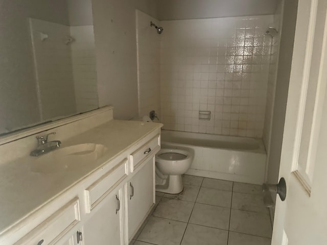bathroom with tub / shower combination, toilet, tile patterned flooring, and vanity