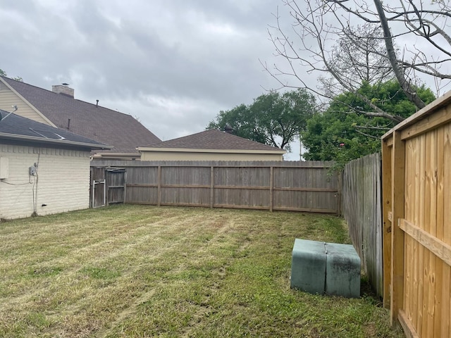 view of yard featuring a fenced backyard