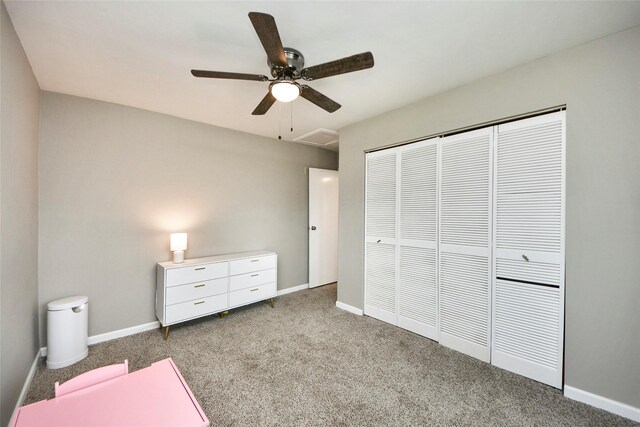 unfurnished bedroom with carpet flooring, baseboards, and a closet