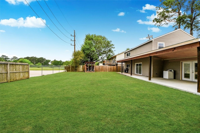 view of yard with a fenced backyard and a patio area