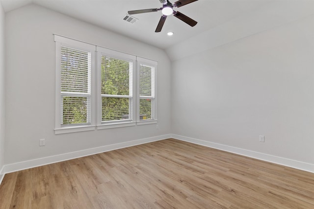 416 13th St, San Leon, TX 77539 - spare room featuring a ceiling fan, lofted ceiling, baseboards, light wood finished floors, and recessed lighting