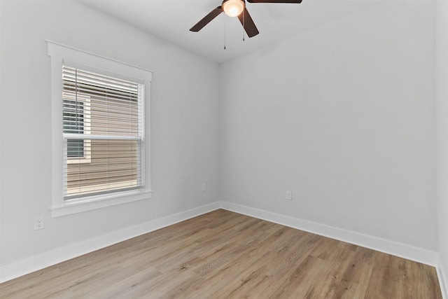 416 13th St, San Leon, TX 77539 - empty room with light wood-style flooring, ceiling fan, and baseboards