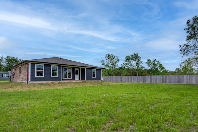6714 Scott St, Liverpool, TX 77577 - view of front of house featuring a front lawn and fence