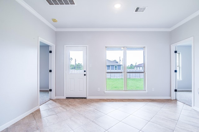 6714 Scott St, Liverpool, TX 77577 - foyer entrance featuring visible vents, baseboards, and ornamental molding