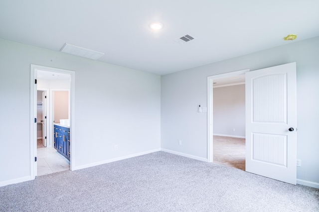 6714 Scott St, Liverpool, TX 77577 - unfurnished bedroom featuring a spacious closet, visible vents, baseboards, and light carpet