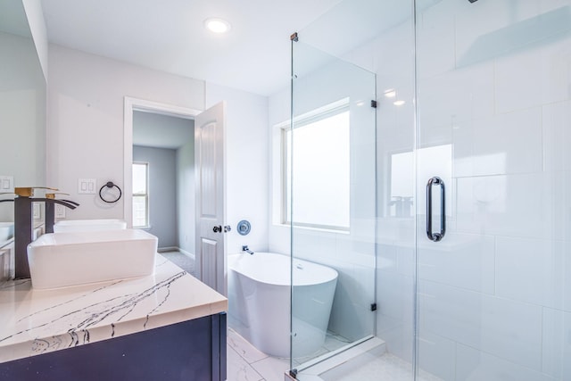 6714 Scott St, Liverpool, TX 77577 - full bath featuring a freestanding bath, vanity, marble finish floor, and a stall shower