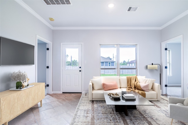 6714 Scott St, Liverpool, TX 77577 - living room with visible vents, baseboards, and crown molding