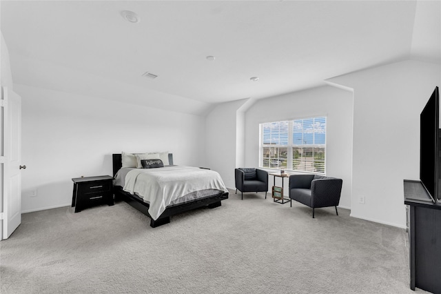 bedroom with lofted ceiling, visible vents, carpet flooring, and baseboards
