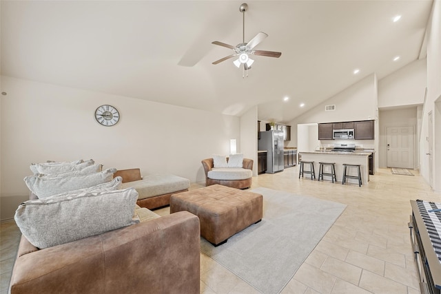 living room featuring ceiling fan, high vaulted ceiling, recessed lighting, and light tile patterned floors