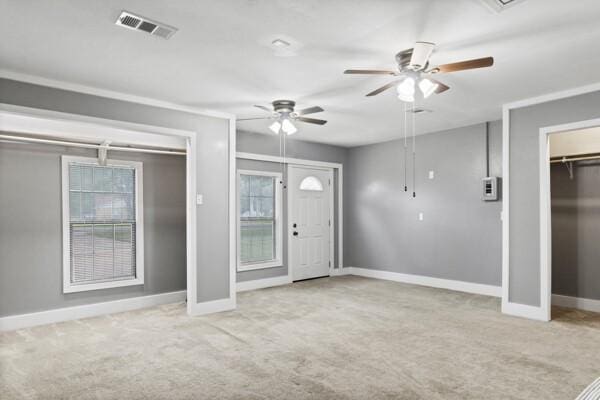 1760 County Road 965, Alvin, TX 77511 - entrance foyer with carpet floors, baseboards, and a ceiling fan