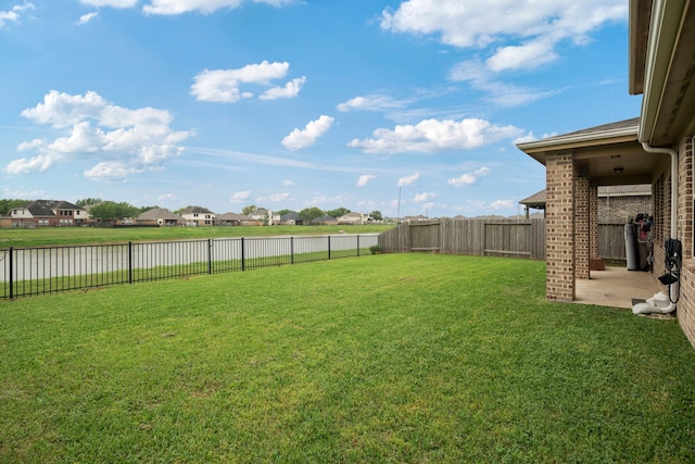 2311 Leonetti Ln, Rosenberg, TX 77471 - view of yard with a water view, a residential view, and a patio