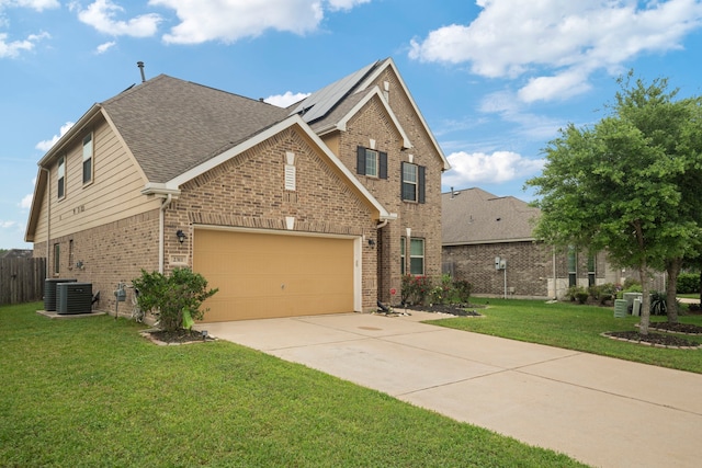 2311 Leonetti Ln, Rosenberg, TX 77471 - traditional-style house with brick siding, concrete driveway, roof with shingles, a garage, and central air condition unit