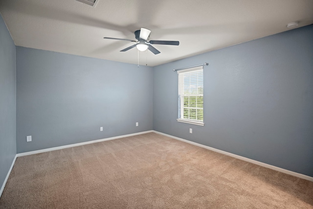 2311 Leonetti Ln, Rosenberg, TX 77471 - unfurnished room featuring a smoke detector, carpet flooring, ceiling fan, and baseboards