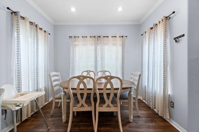 dining room with recessed lighting, crown molding, baseboards, and dark wood finished floors