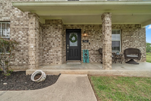 entrance to property with brick siding
