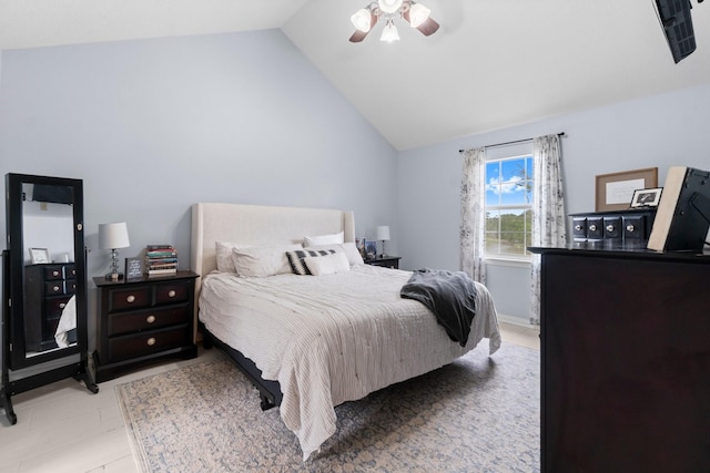 bedroom featuring vaulted ceiling and a ceiling fan