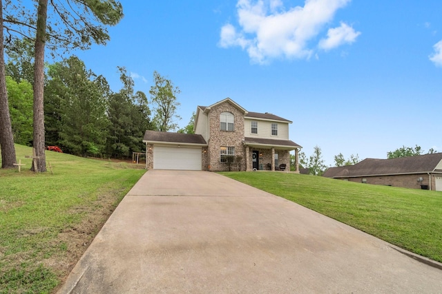 traditional home featuring a front yard, an attached garage, brick siding, and concrete driveway