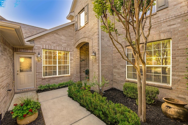 property entrance with brick siding