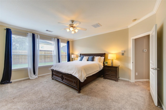 bedroom with crown molding, visible vents, baseboards, and light carpet