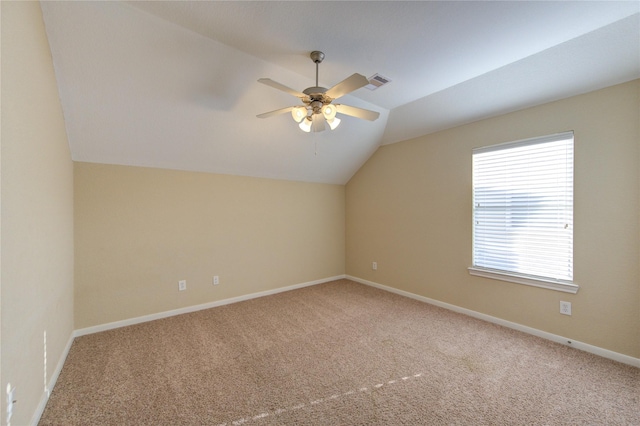 bonus room with visible vents, baseboards, a ceiling fan, vaulted ceiling, and carpet flooring