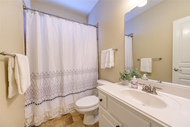 full bath featuring toilet, vanity, and a shower with curtain