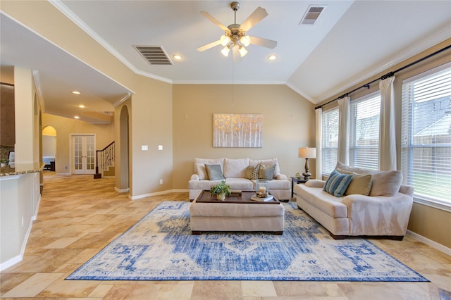 living area featuring arched walkways, crown molding, lofted ceiling, and visible vents