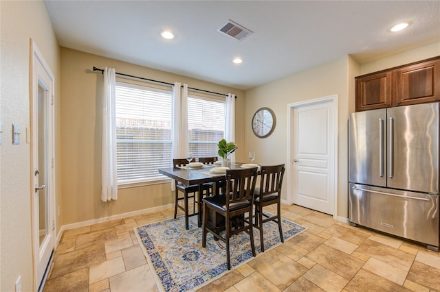 dining area with recessed lighting, visible vents, baseboards, and stone tile flooring