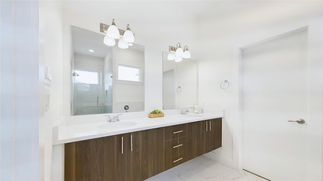 9628 Habitat St, Houston, TX 77075 - bathroom featuring double vanity, a shower stall, marble finish floor, and a sink