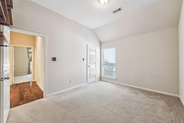 2230 Dali Ln, Missouri City, TX 77459 - carpeted spare room with baseboards, lofted ceiling, and visible vents