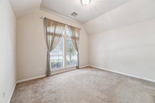 2230 Dali Ln, Missouri City, TX 77459 - unfurnished room featuring carpet, visible vents, baseboards, and vaulted ceiling