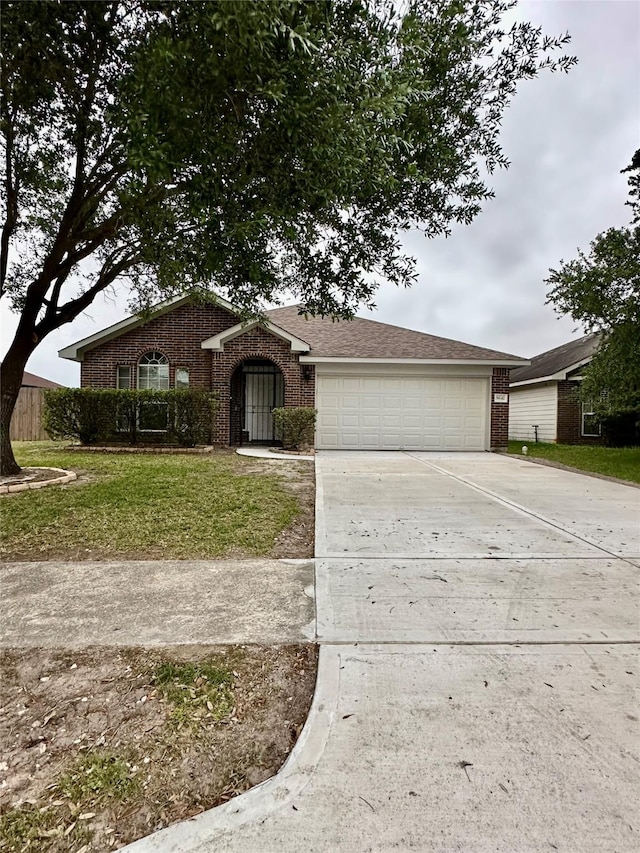 single story home with brick siding, driveway, and an attached garage