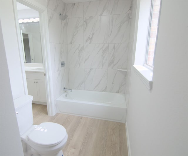 2807 Balmorhea Ave, Houston, TX 77039 - bathroom featuring toilet, vanity, shower / bath combination, and wood finished floors