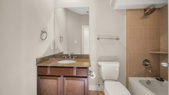 full bathroom featuring tub / shower combination, toilet, and vanity