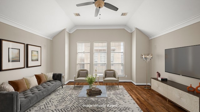 living area featuring visible vents, vaulted ceiling, and a ceiling fan