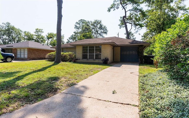 2315 Poinciana Dr, Houston, TX 77018 - view of front facade featuring a front lawn, driveway, an attached garage, and brick siding