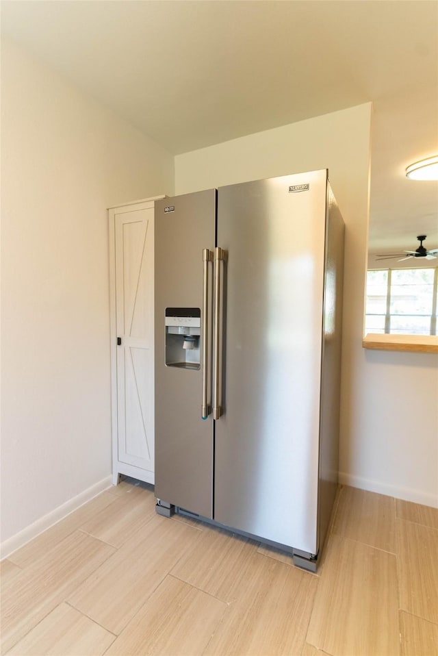 2315 Poinciana Dr, Houston, TX 77018 - kitchen featuring baseboards, high end fridge, and light wood-style flooring