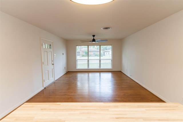 2315 Poinciana Dr, Houston, TX 77018 - empty room featuring baseboards, visible vents, ceiling fan, and wood finished floors
