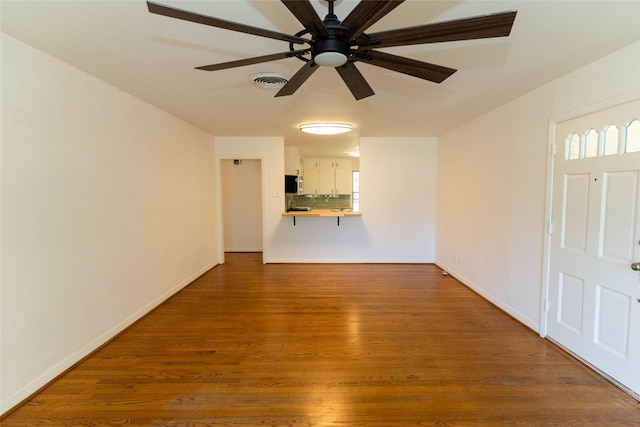 2315 Poinciana Dr, Houston, TX 77018 - unfurnished living room with wood finished floors, plenty of natural light, baseboards, visible vents, and ceiling fan