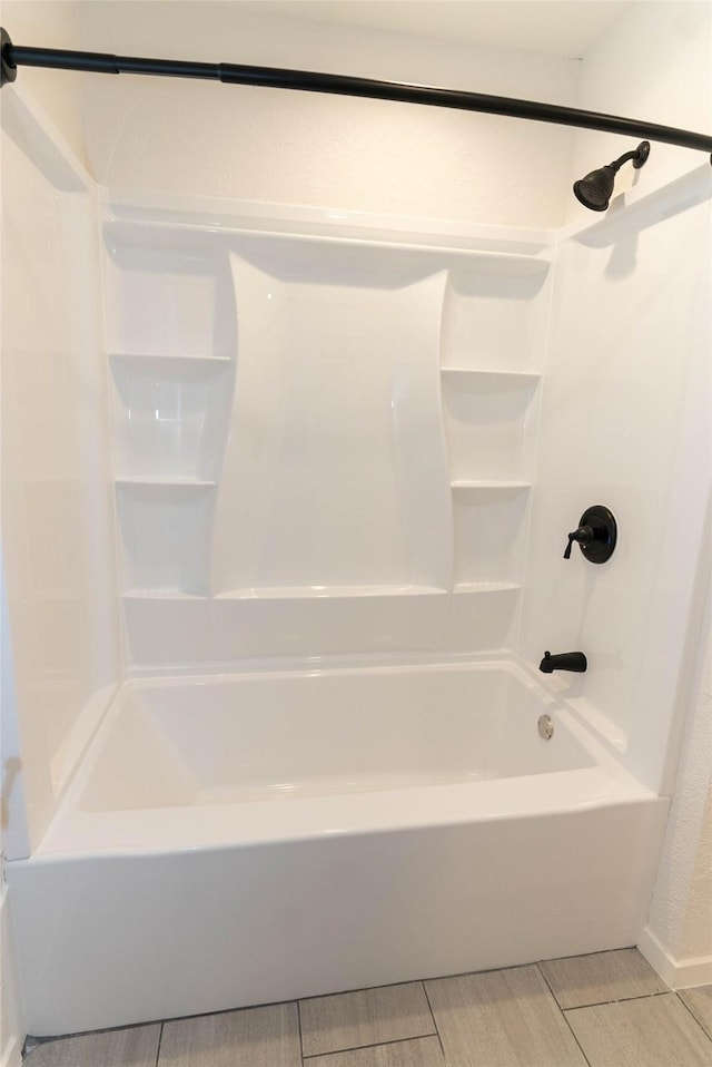 2315 Poinciana Dr, Houston, TX 77018 - bathroom with shower / tub combination and wood tiled floor
