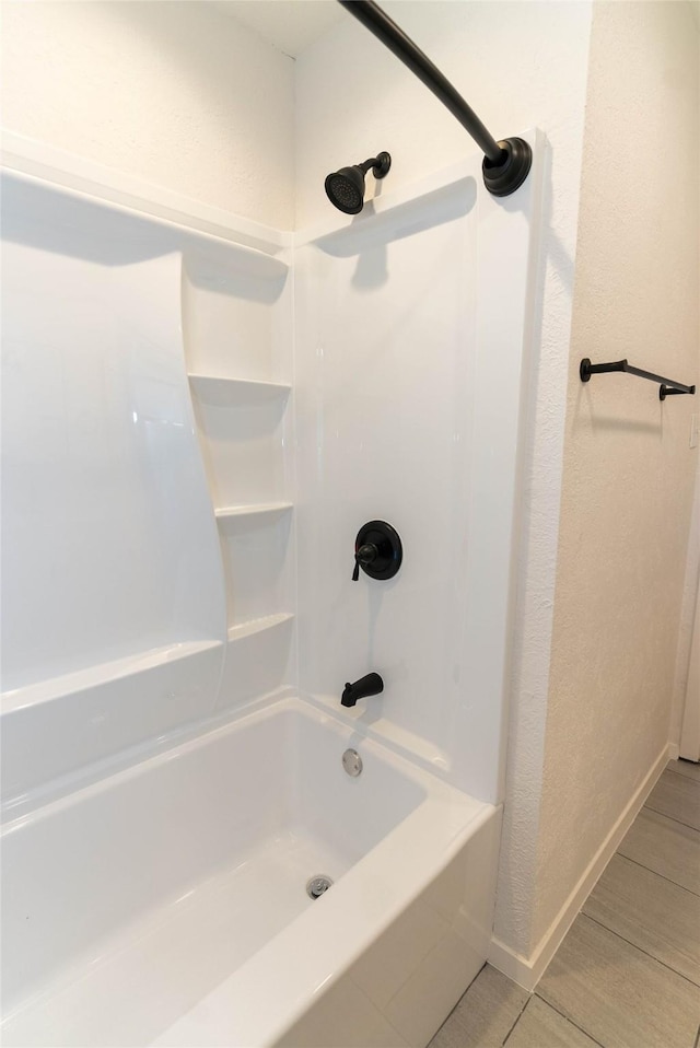 2315 Poinciana Dr, Houston, TX 77018 - full bath featuring baseboards, wood finished floors, and washtub / shower combination