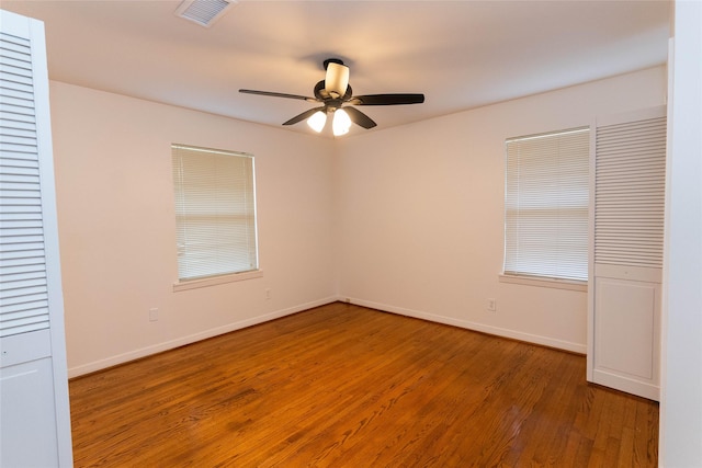 2315 Poinciana Dr, Houston, TX 77018 - empty room featuring baseboards, visible vents, a ceiling fan, and wood finished floors