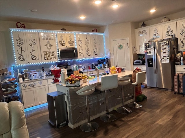 20334 Fossil Valley Ln, Cypress, TX 77433 - kitchen with light countertops, white cabinetry, stainless steel appliances, and dark wood-style floors